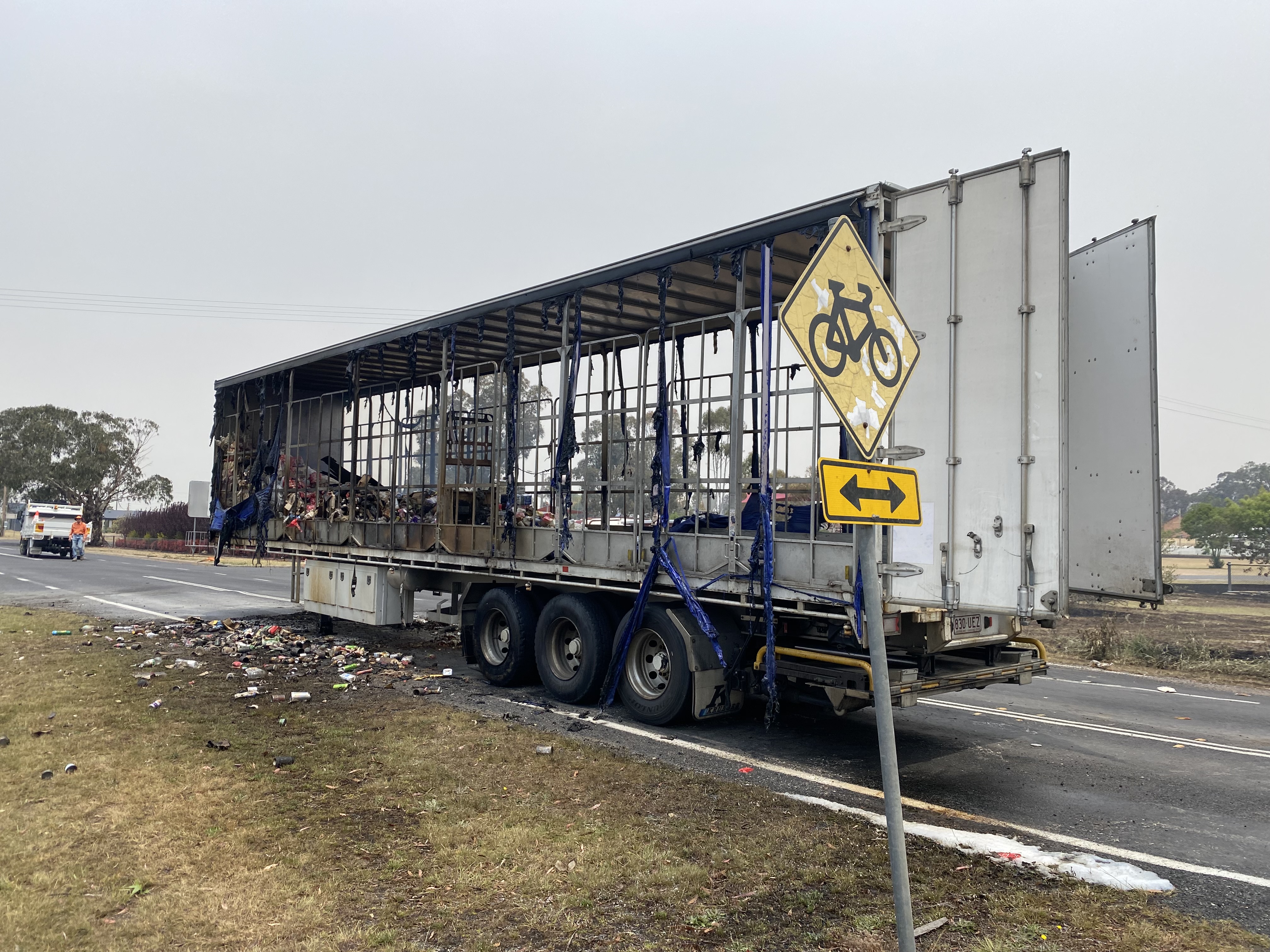 The remains of a truck trailer that got caught in the New England Highway bushfire